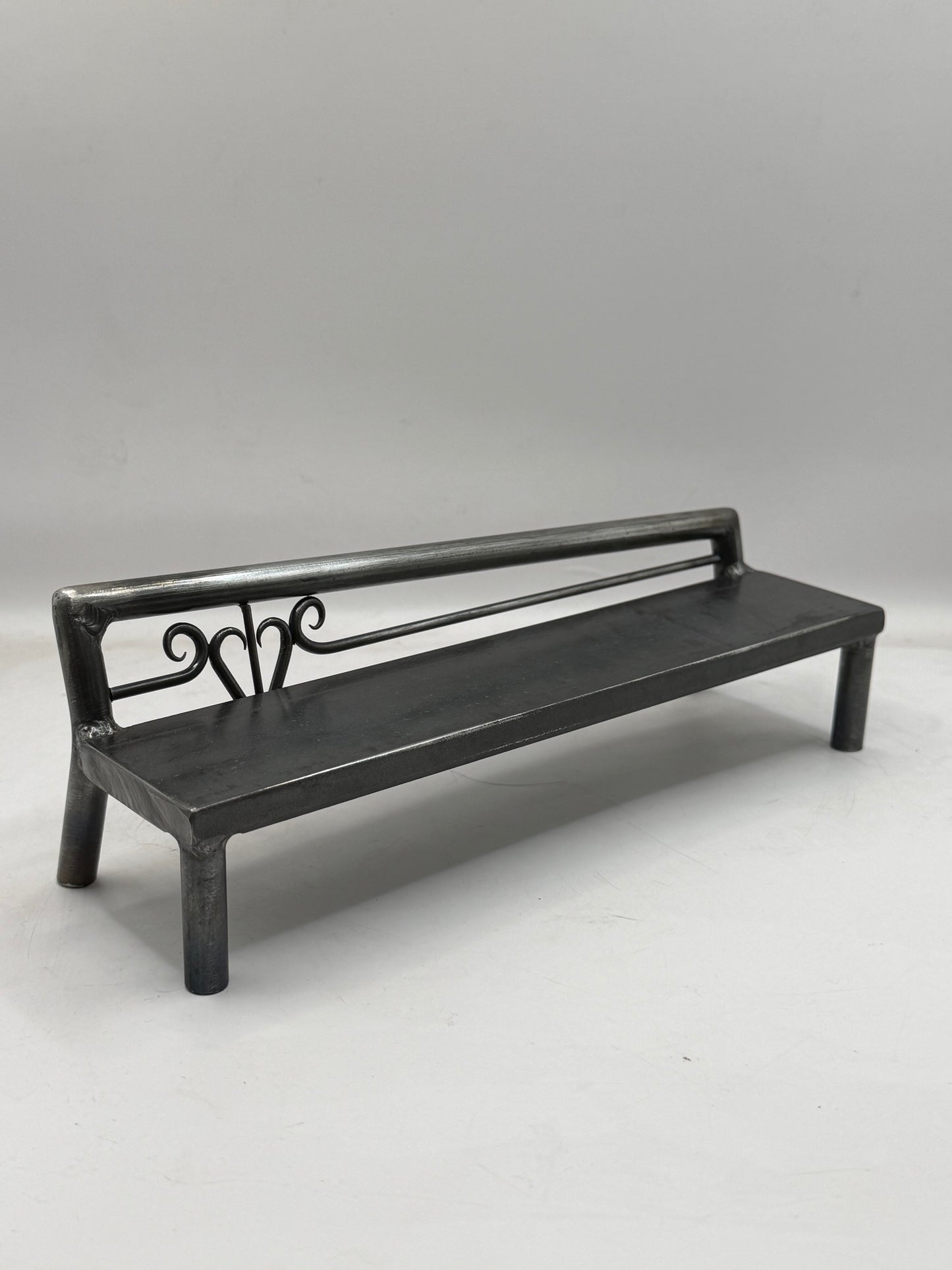 Left top rail scrolled heart bench 1 of 1